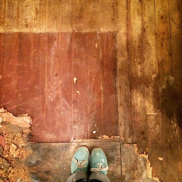 Under the kitchen tiled floor was this c. 1930s painted wood with a border of pale yellow and burgundy in the middle. 